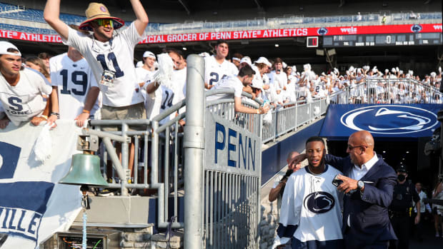 Penn State coach James Franklin talks with Saquon Barkley in the Beaver Stadium tunnel prior to the Nittany Lions' 2021 game against Auburn.